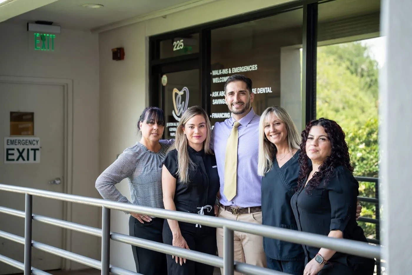 Dr. Justin Hosseini and the Weston Dental Center team on the office balcony